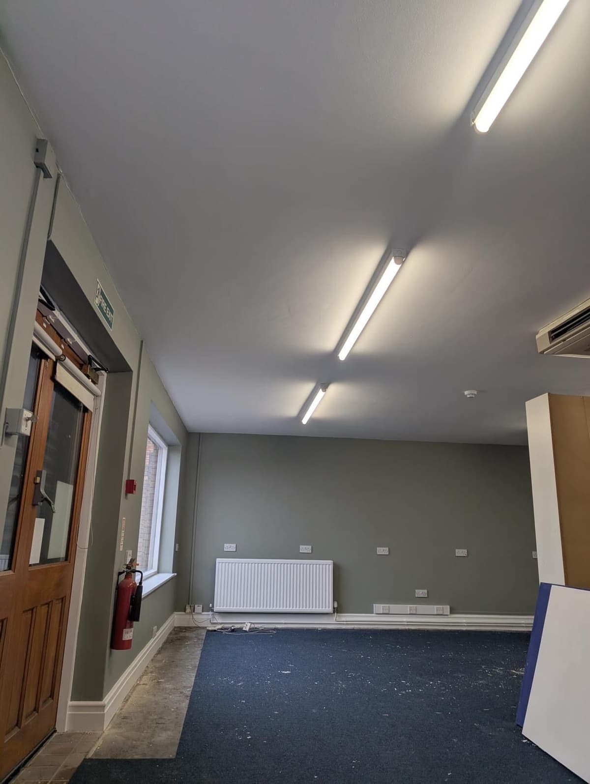 Commercial room with sage green painted walls