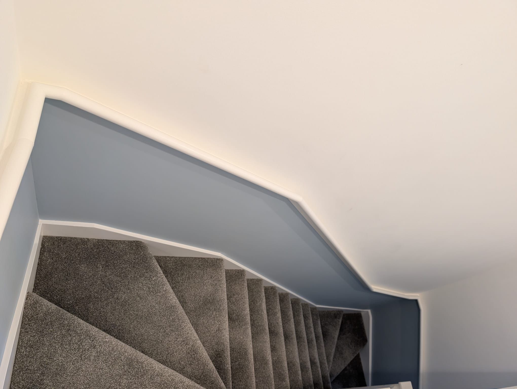 Two-tone painted stairwell by JSC