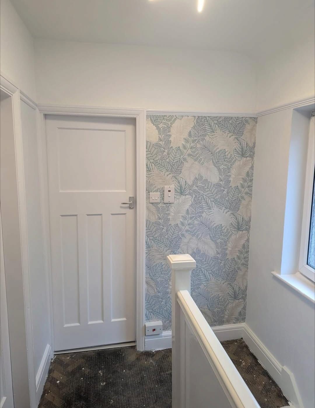 Wallpapered landing decorated by JSC